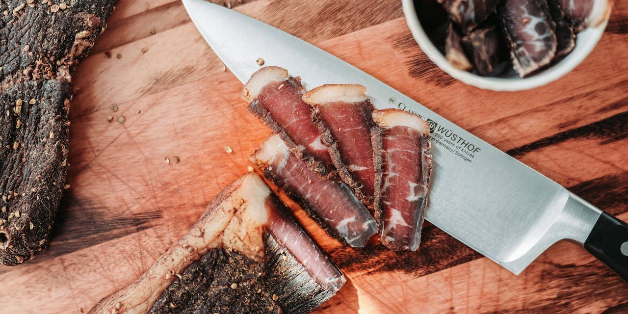 A cut of lean meat on a cutting board: the best meat for beef jerky