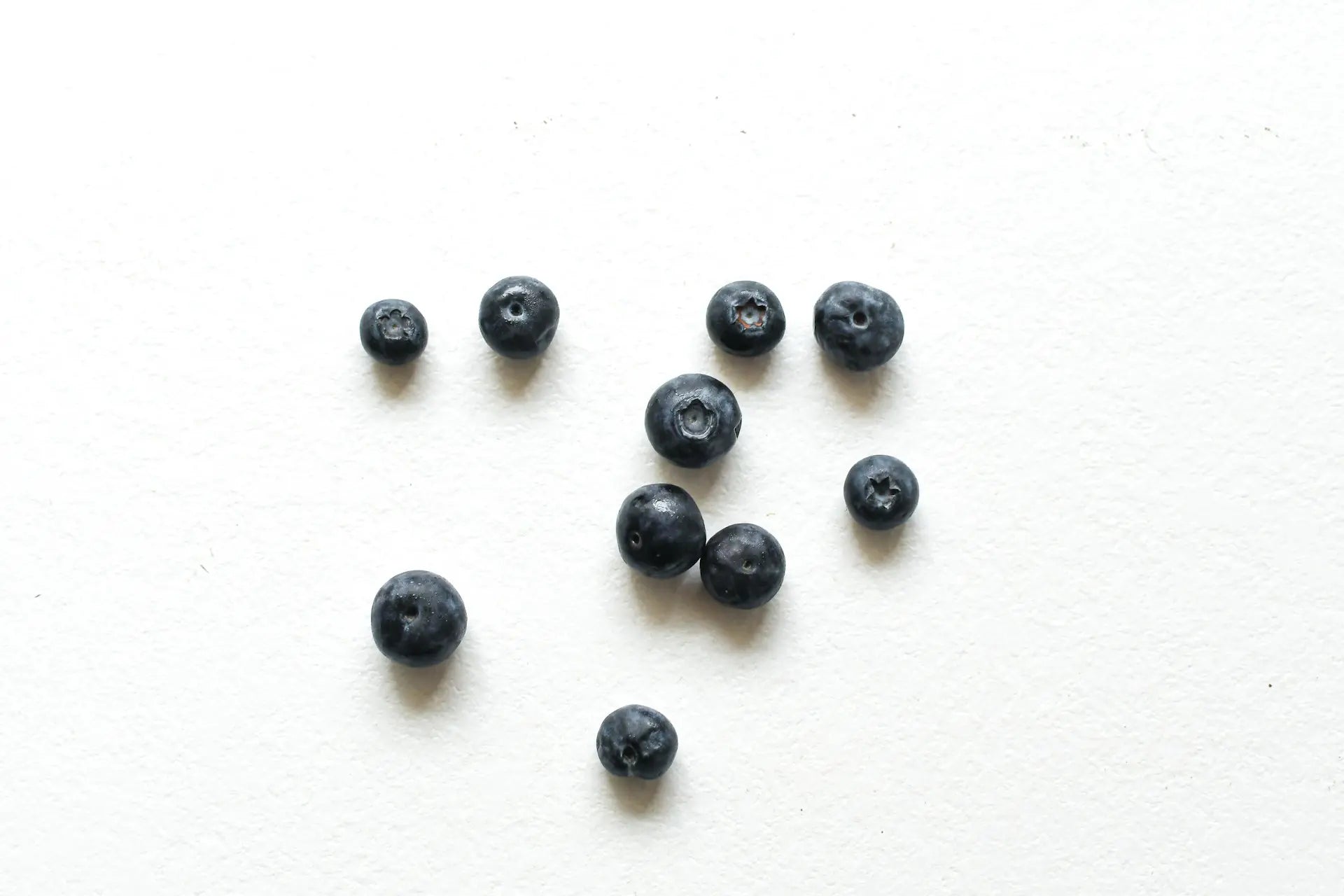 Blueberries on a white table to illustrate healthy snack ideas for busy families