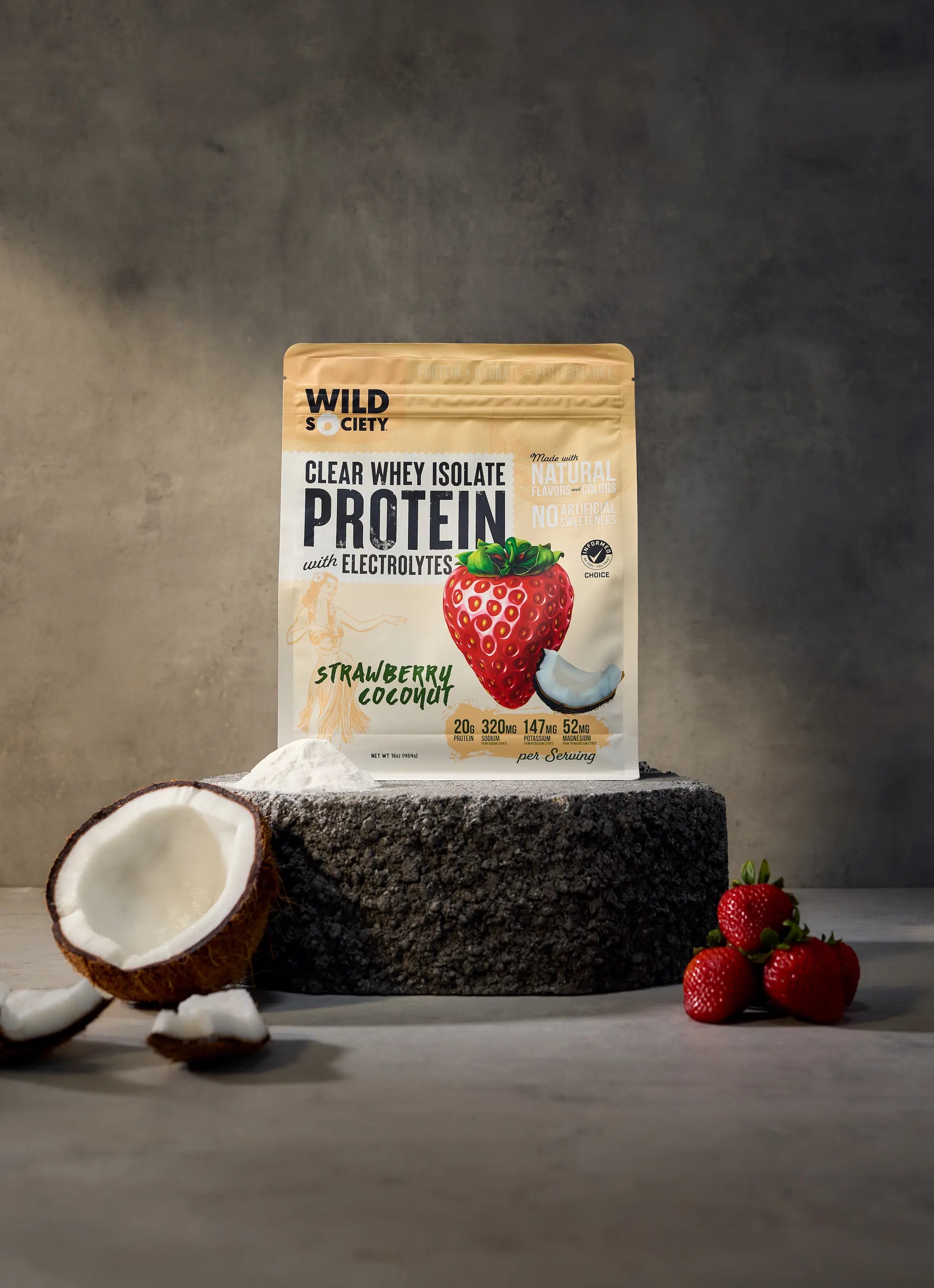clear whey protein powder strawberry coconut on a cement block with dark background