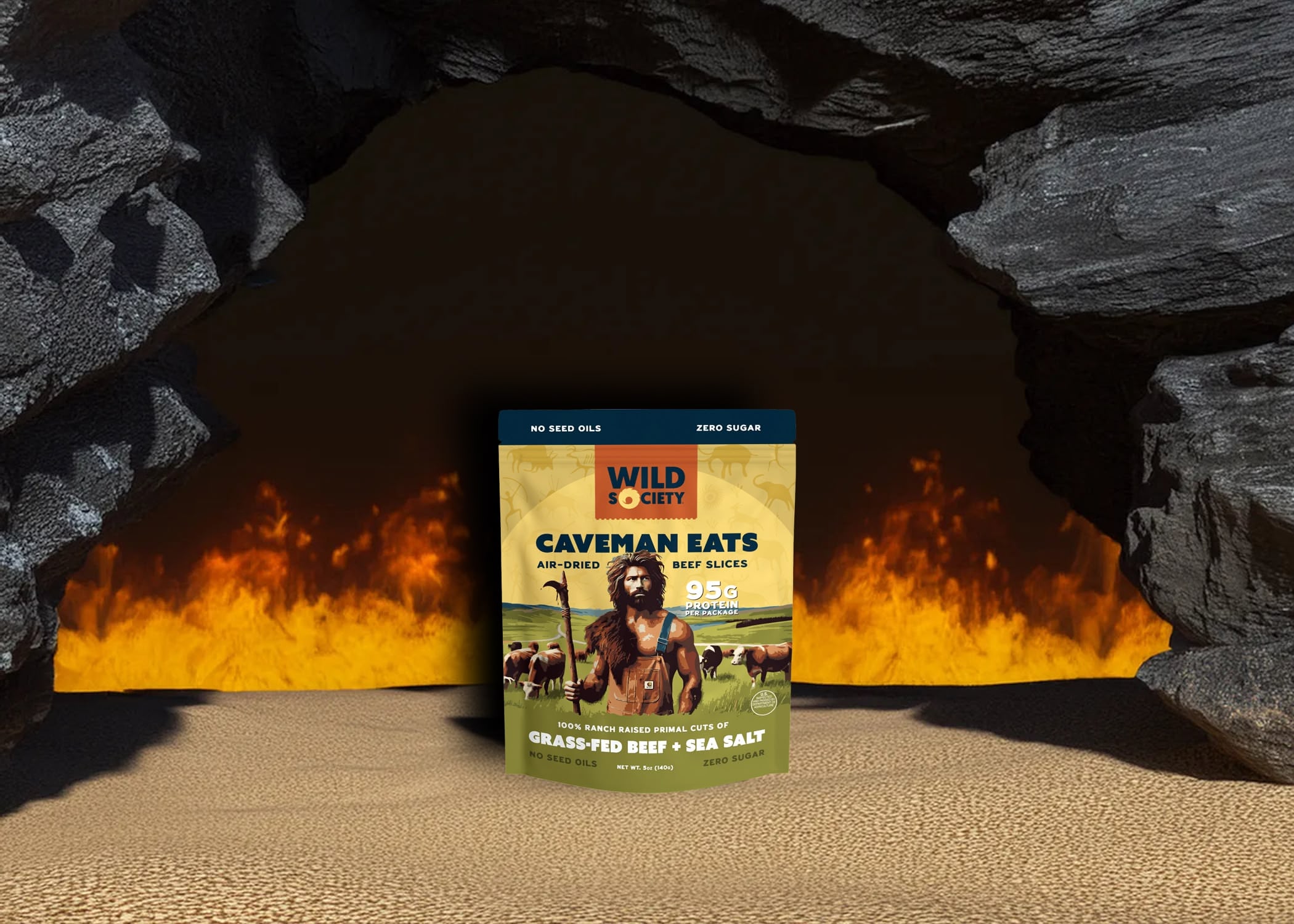 Wild One Caveman Eats package in front of a cave entrance with flames