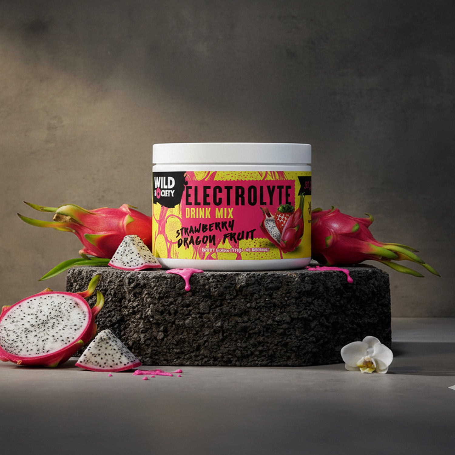 Electrolyte drink mix container with dragon fruit on a dark surface