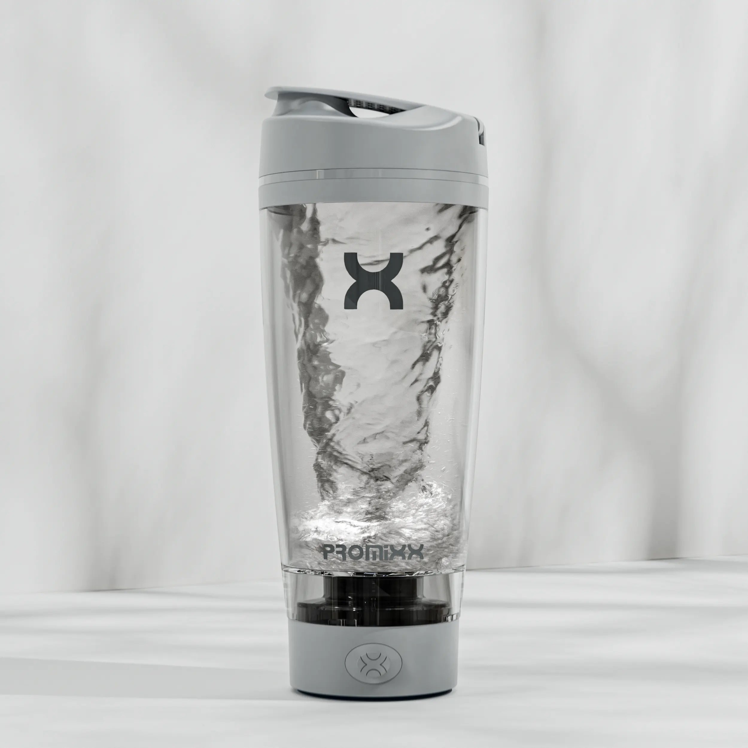 Gray and clear tumbler with a brand logo on a white background