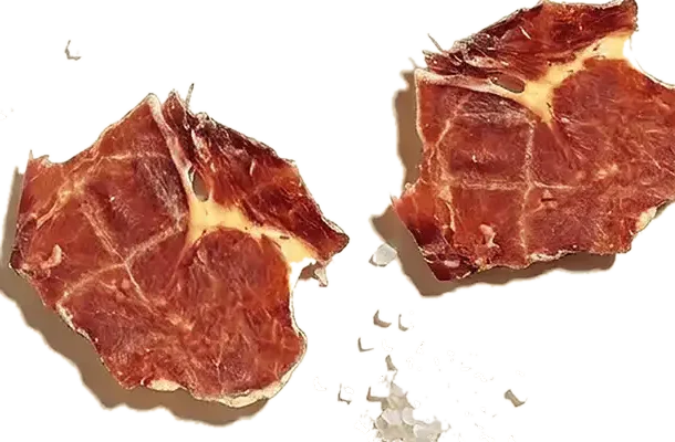 Slices of Caveman Eats ribeye with sea salt