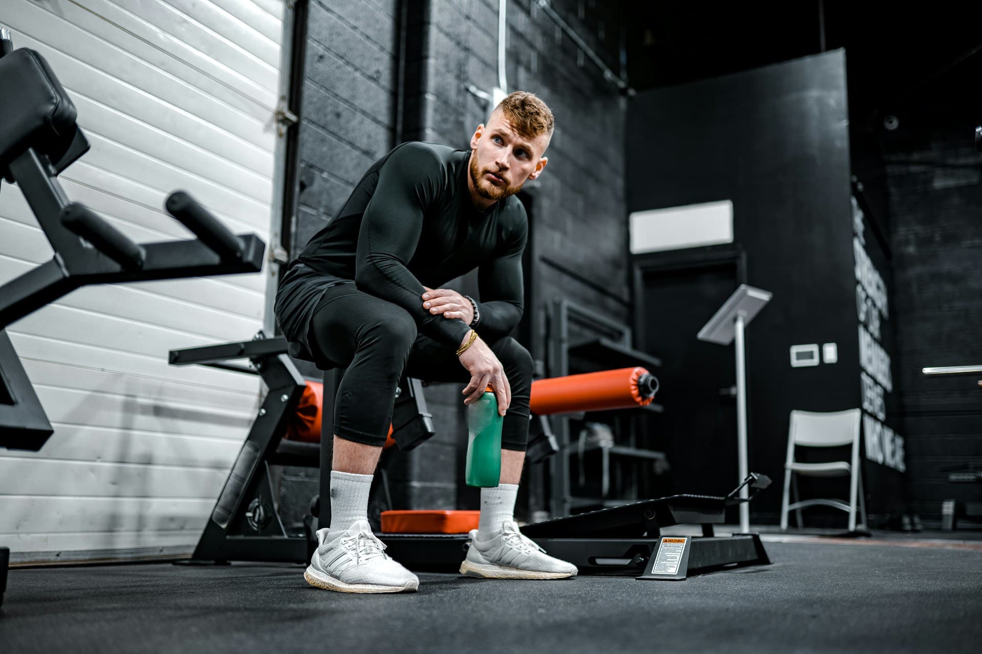  10-Minute Post-Workout Recovery Routine - man hydrating after a workout 