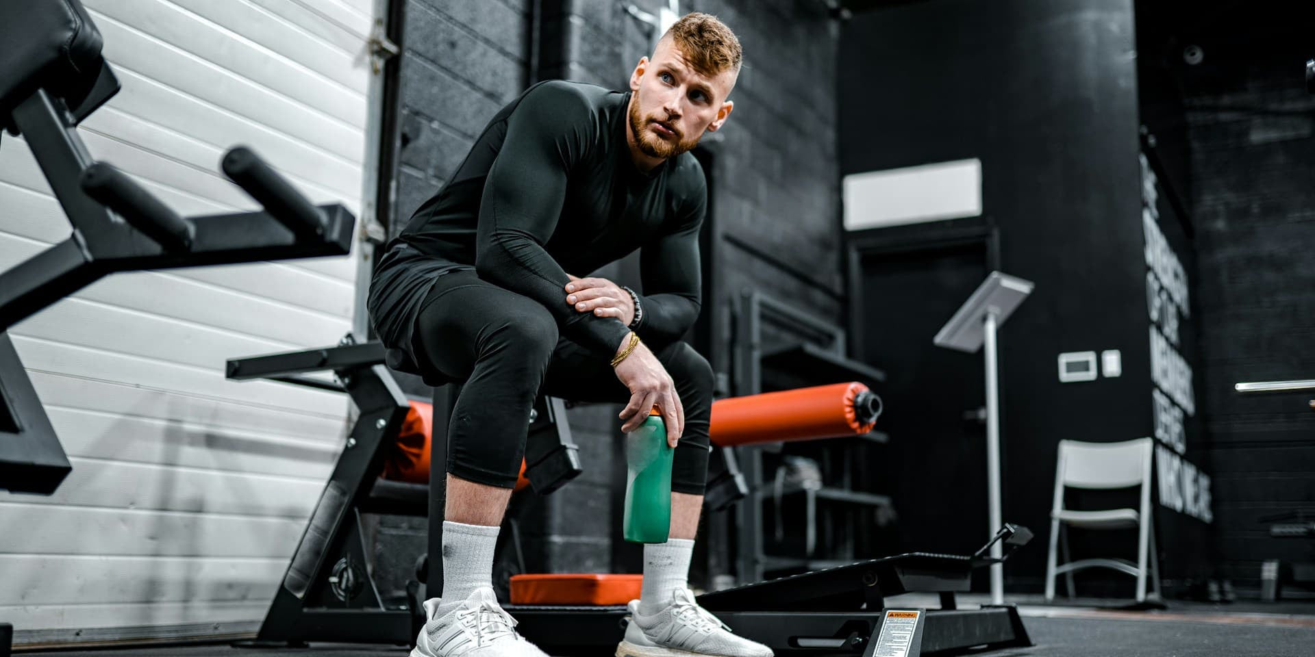  10-Minute Post-Workout Recovery Routine - man hydrating after a workout 