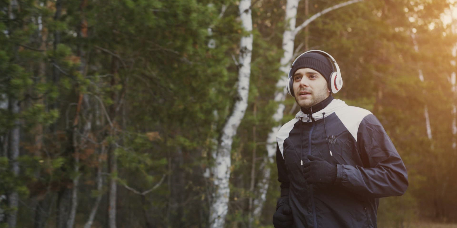30-Day Reset: A man running in the morning with headphones
