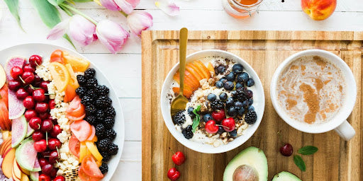 A colorful array of plates filled with fresh fruits and lean proteins, answering the question of what to eat on semaglutide.