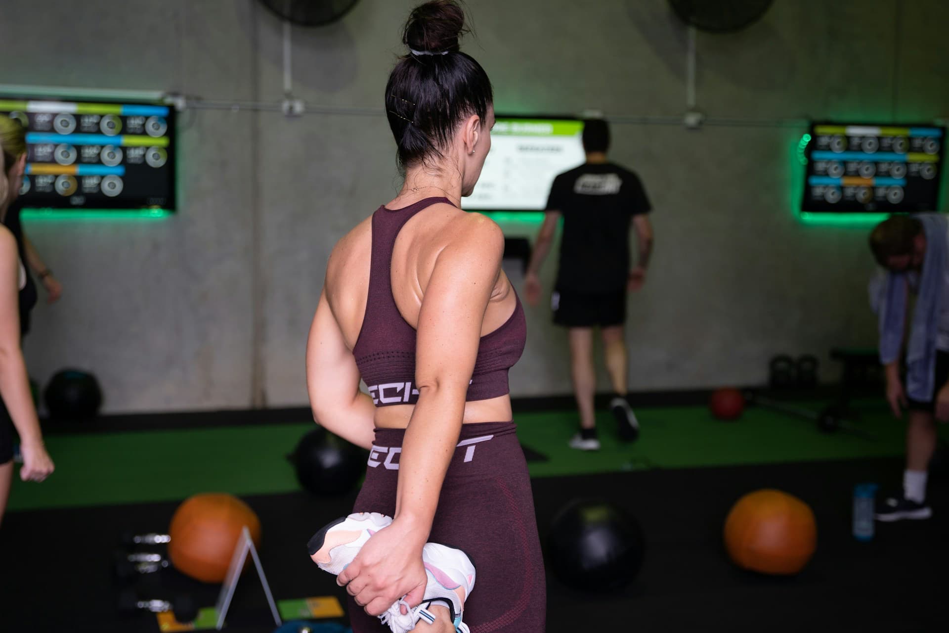 woman stretches, wondering Do I Need a Pre-Workout?