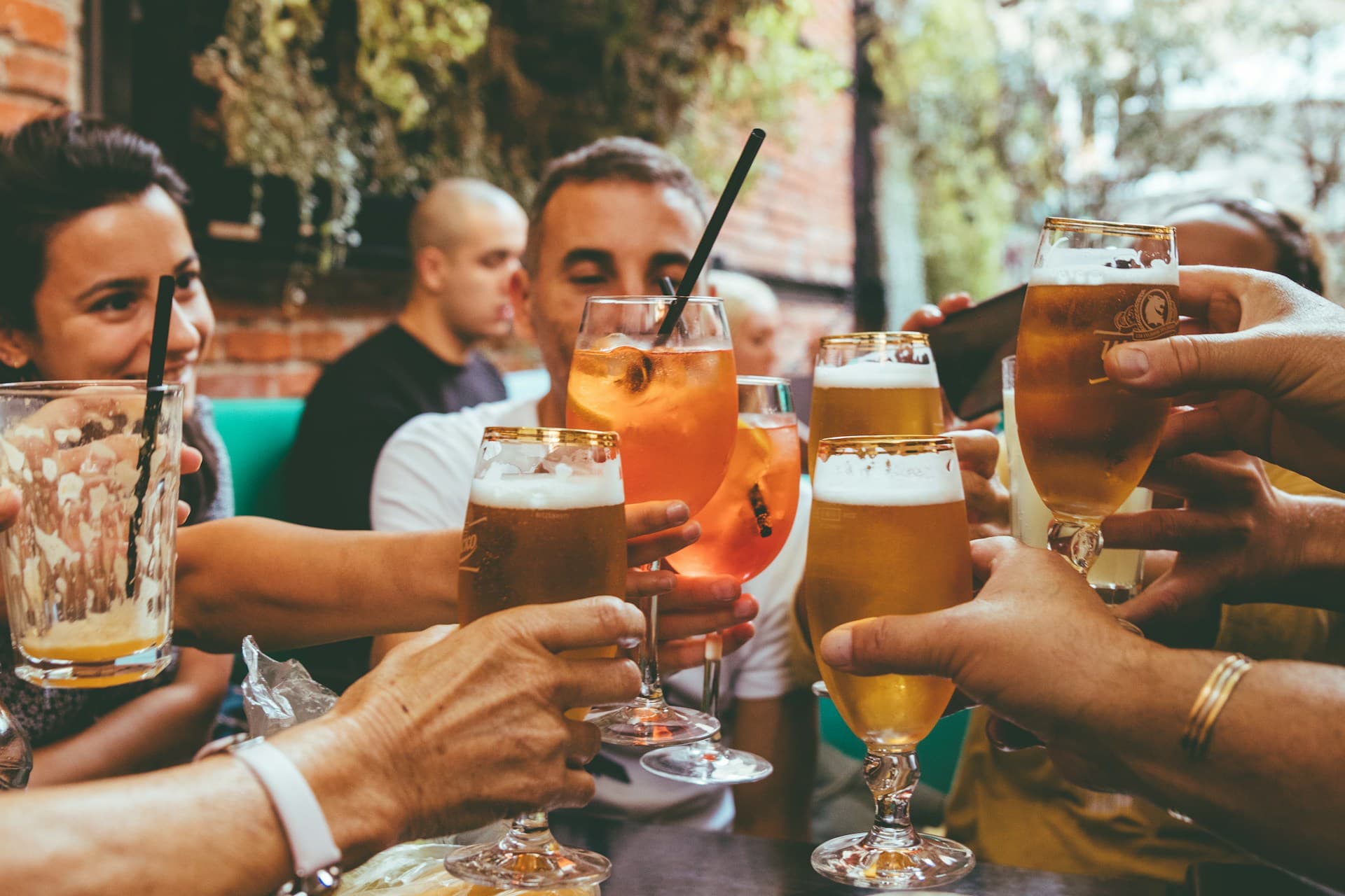 Does alcohol stop muscle growth? A group of people drinking beer ask. 