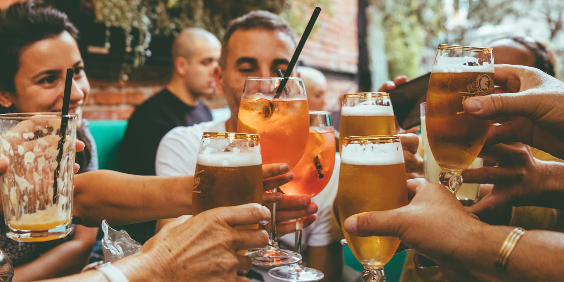 Does alcohol stop muscle growth? A group of people drinking beer ask. 
