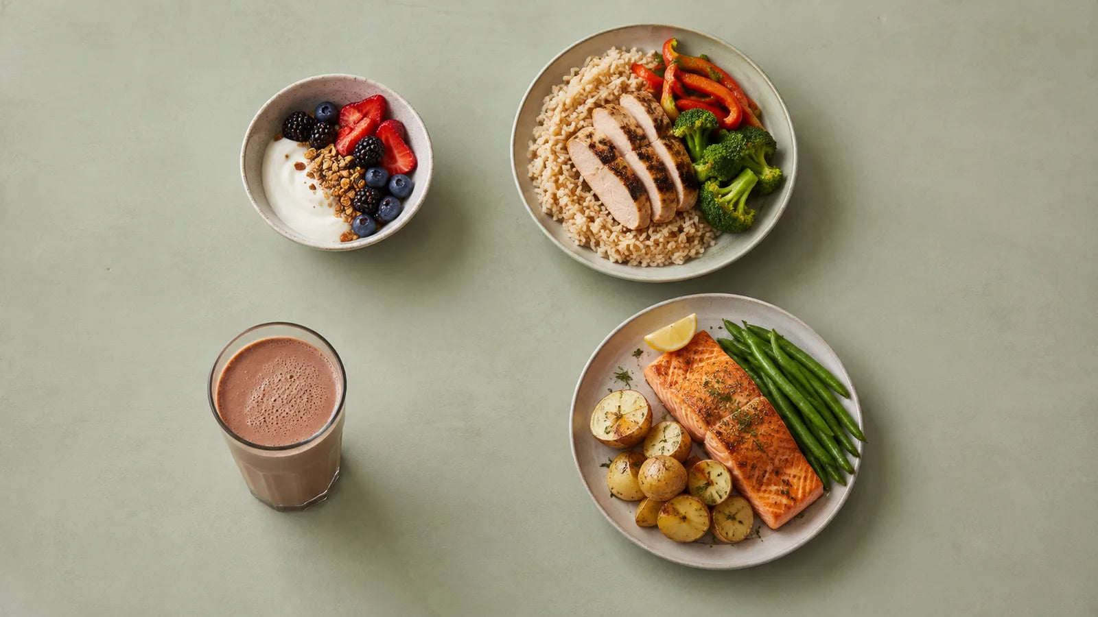 AI-generated overhead scene of three varied meals and one chocolate shake