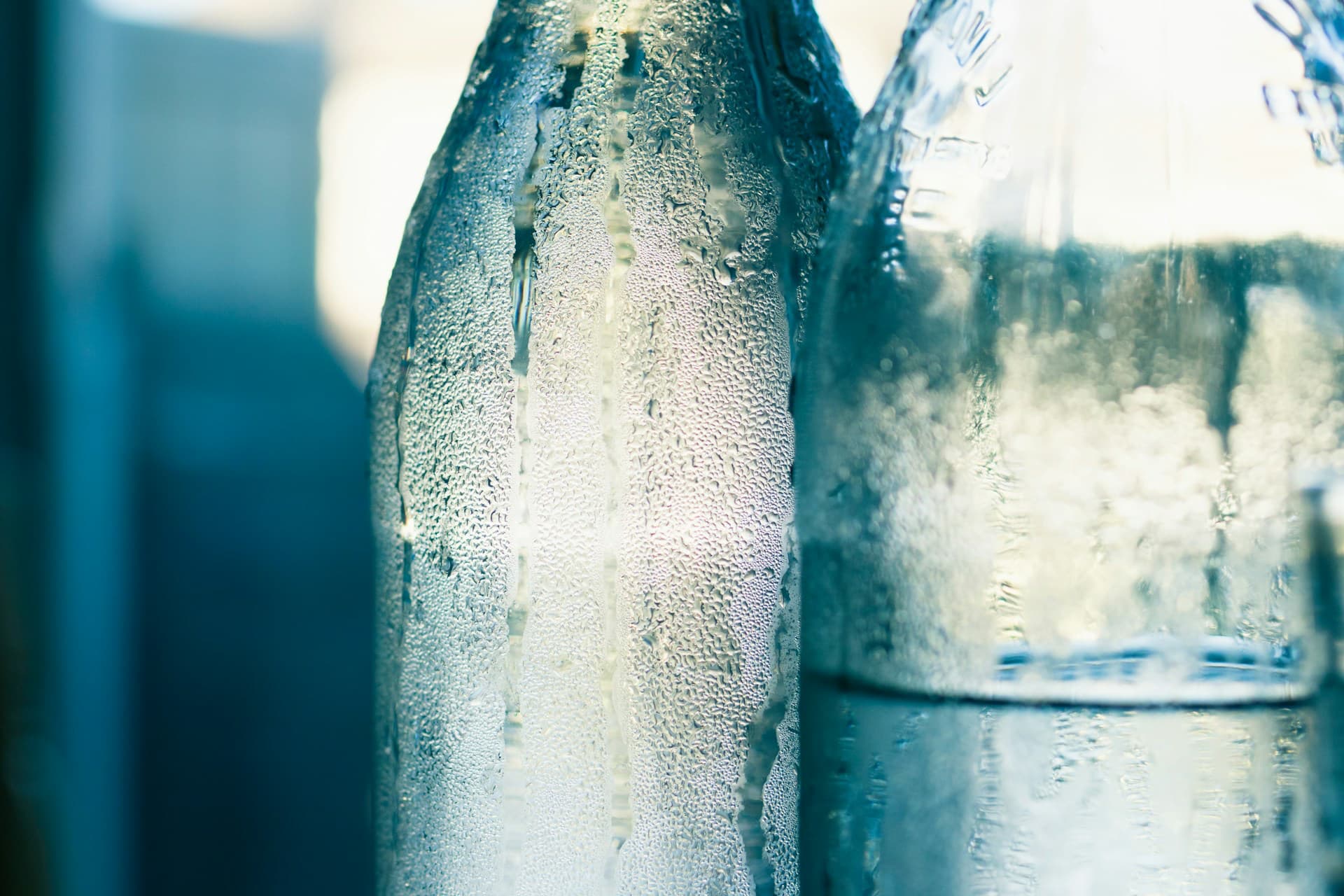 Glass bottles covered in condensation