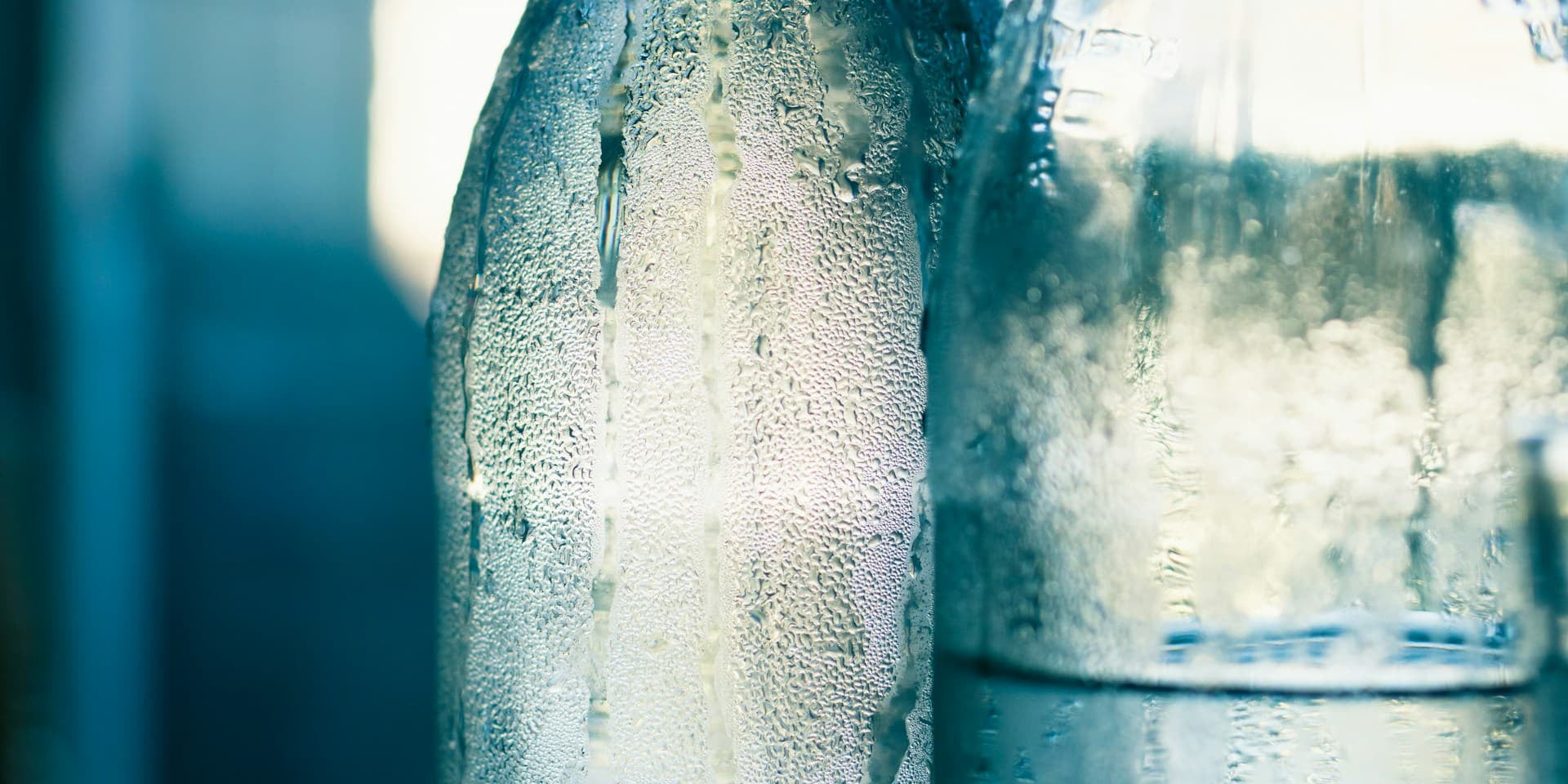 Glass bottles covered in condensation