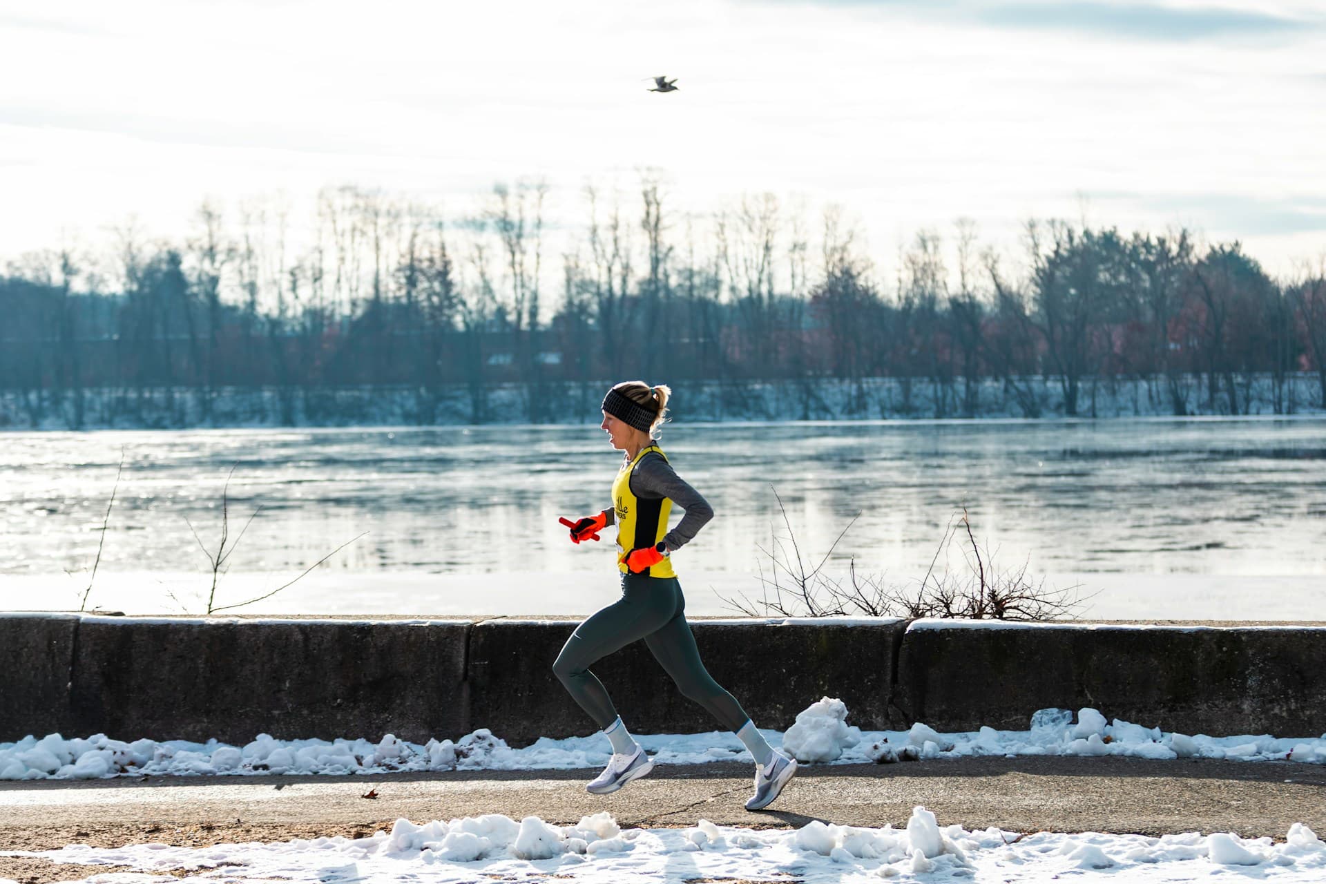 Woman running outside for a winter workout