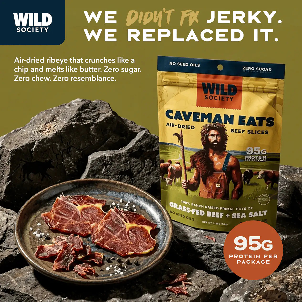 Wild Society Caveman Eats beef jerky package with air-dried beef slices on a rock background