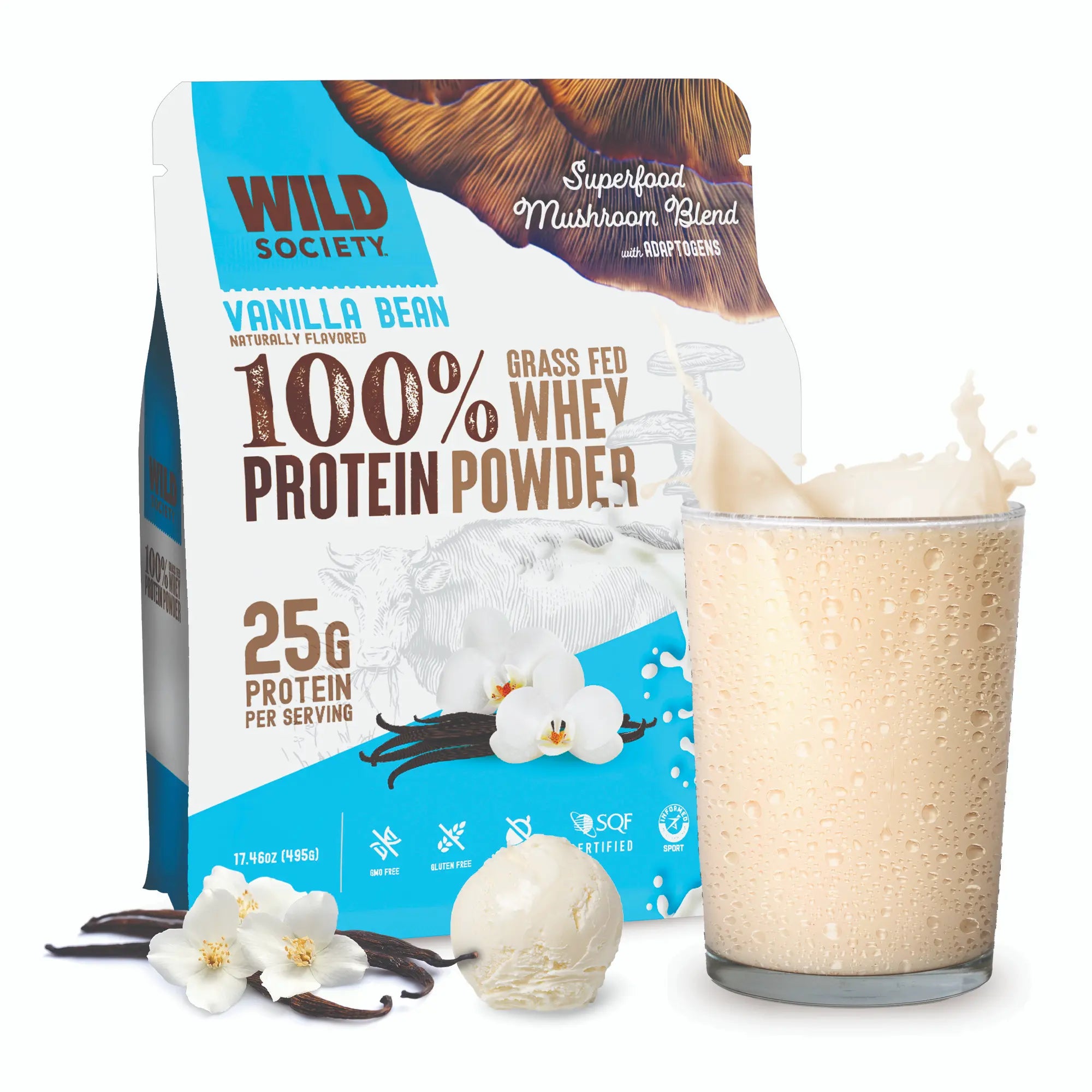 Wild Society Vanilla Bean 100% Whey Protein Powder pouch shown with a glass of creamy beige protein shake, vanilla beans, and vanilla flower props on a clean white background.