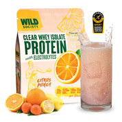 Wild Society protein powder package with a glass of citrus punch protein shake.