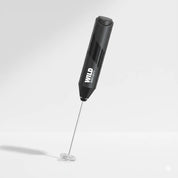 Black handheld milk frother with 'WILD Society' branding on a white background